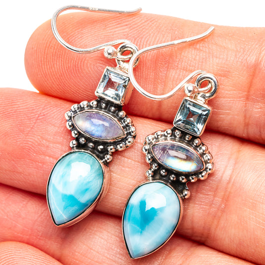 Sterling silver drop earrings with blue teardrop larimar and moonstone, topped with blue topaz