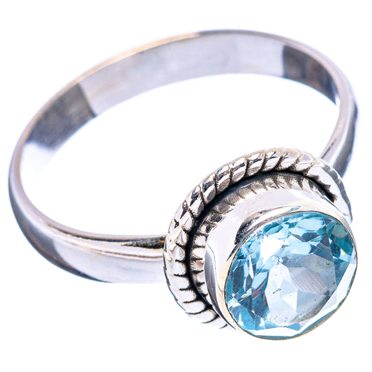 Sterling silver ring with round blue topaz faceted stone, braided bezel and wide band
