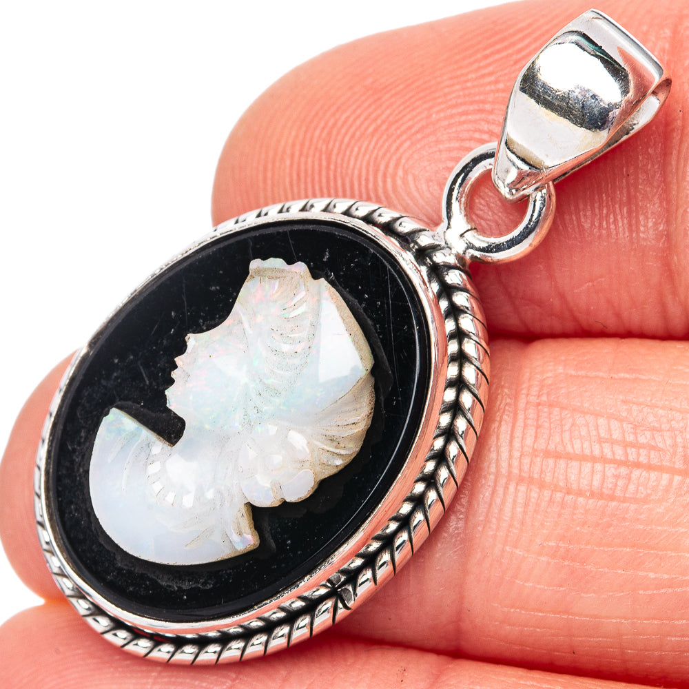 Sterling silver oval cameo pendant with opal lady face on black background