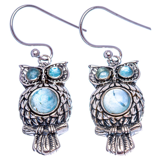 Sterling silver owl earrings with light blue gemstone eyes and round center stone