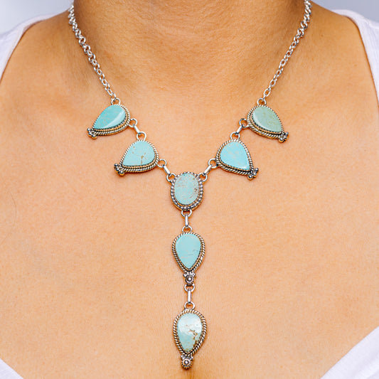 Turquoise teardrop silver necklace with linked chain and multiple blue stone drops