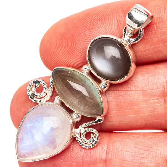 Sterling silver moonstone pendant with oval cabochon and iridescent sheen