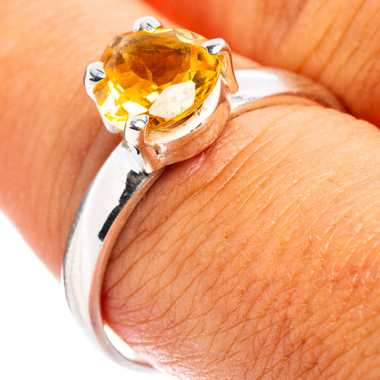 Faceted citrine stone sterling silver ring with square prong setting, close-up