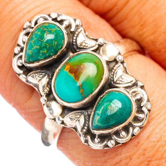 Turquoise oval stone adjustable silver ring with three settings on a wrap-style band