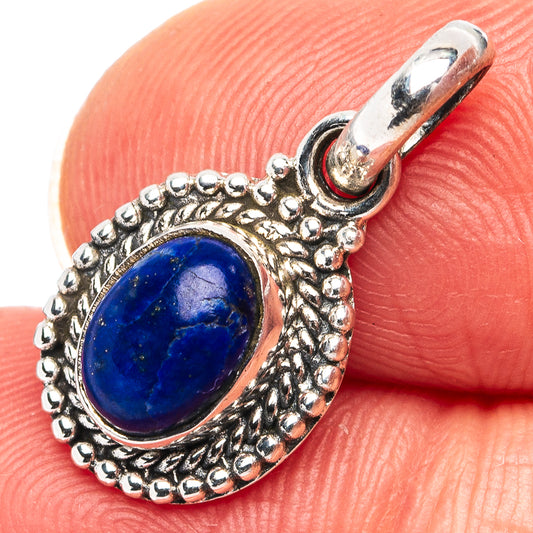 Sterling silver lapis lazuli pendant, oval blue cabochon with textured rope-like edge