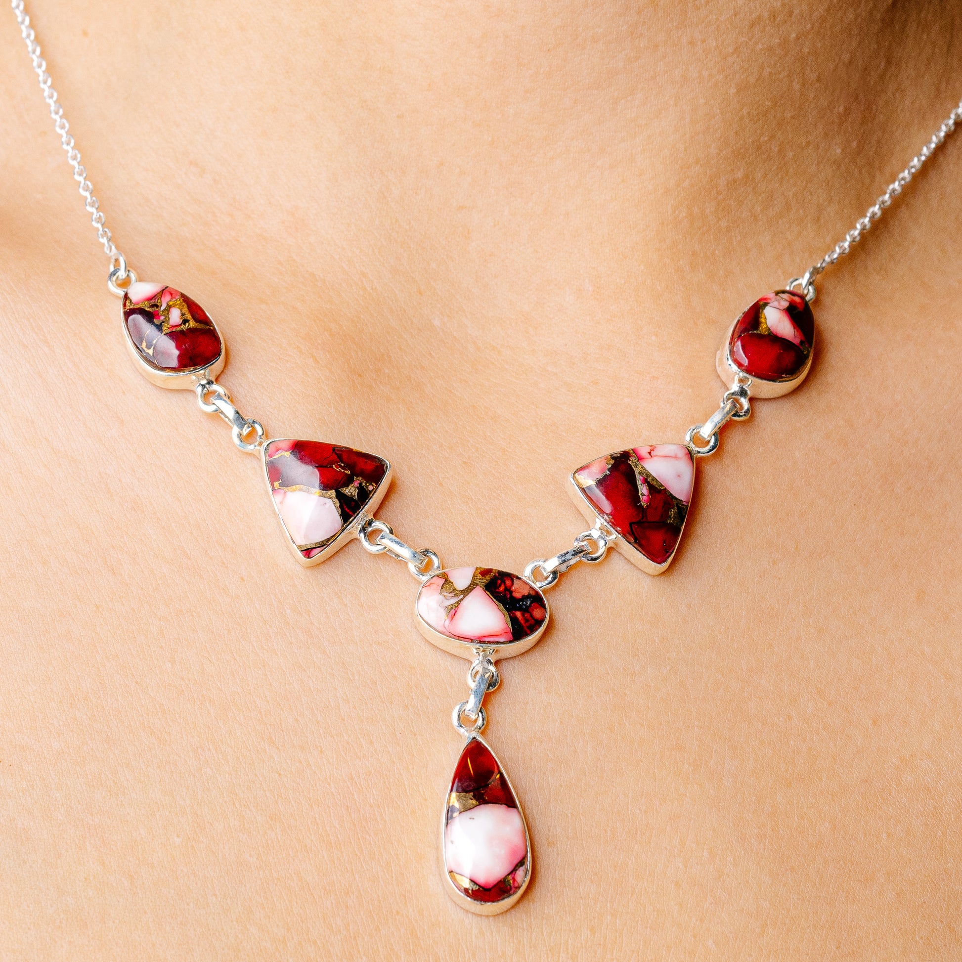 Sterling silver necklace with red and pink composite cabochon teardrops and ovals