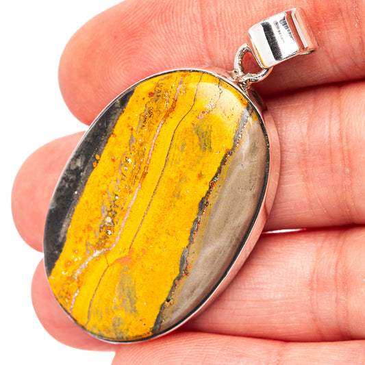 Bumblebee jasper oval pendant with silver bail, yellow and black stone set in .925 silver.