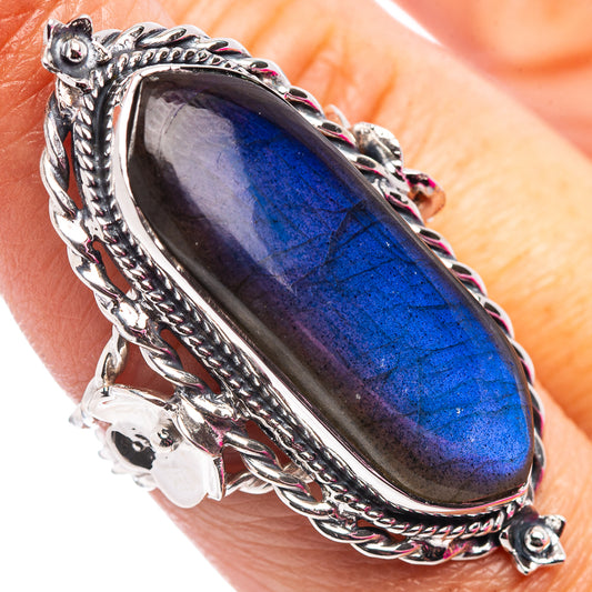Sterling silver labradorite ring with blue oval gemstone and ornate filigree bezel