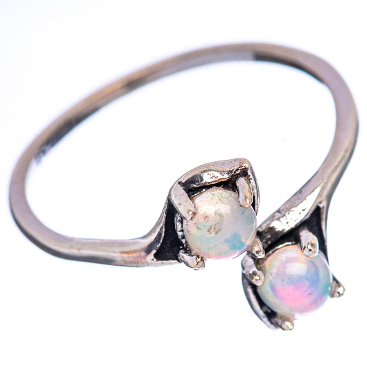 Sterling silver opal ring with round Ethiopian opal center and smaller side opal stones