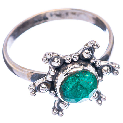 Sterling silver ring with green oval gemstone, scrolled openwork side details