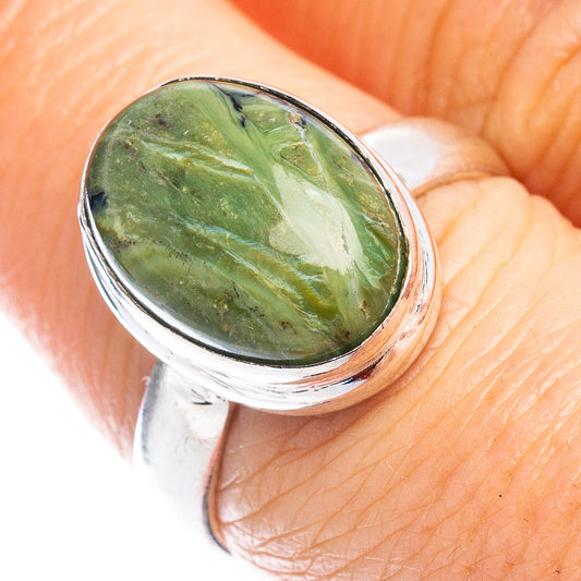 Green opal oval ring in polished silver band, gemstone set atop