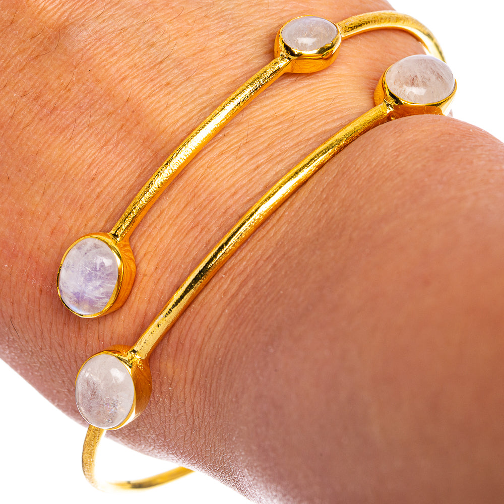 Gold-tone open cuff bracelet with four oval rainbow moonstone cabochons