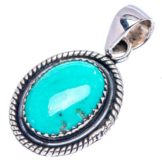 Oval turquoise cabochon pendant with dark bezel and rope border, sterling silver bail