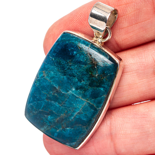 Apatite pendant in sterling silver bezel, rectangular blue-green stone with bail.