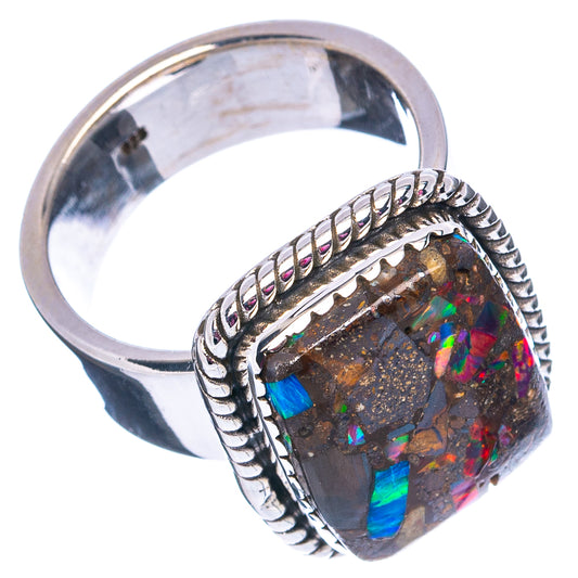 Sterling silver ring showing opal matrix stone and rope-style bezel band