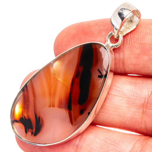 Orange amber teardrop agate pendant with black flame patterns, .925 sterling silver bail