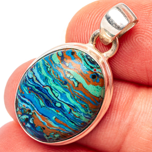Calsilica pendant in oval sterling silver bezel, colorful rainbow marbled stone.