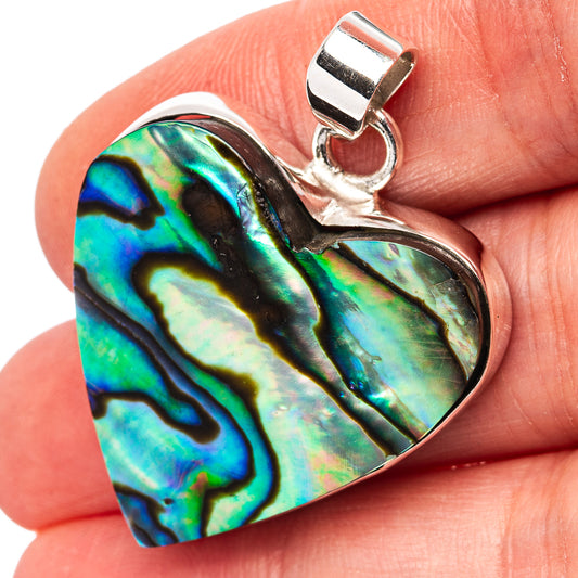 Abalone shell pendant with .925 sterling silver bail, iridescent blue-green heart shape