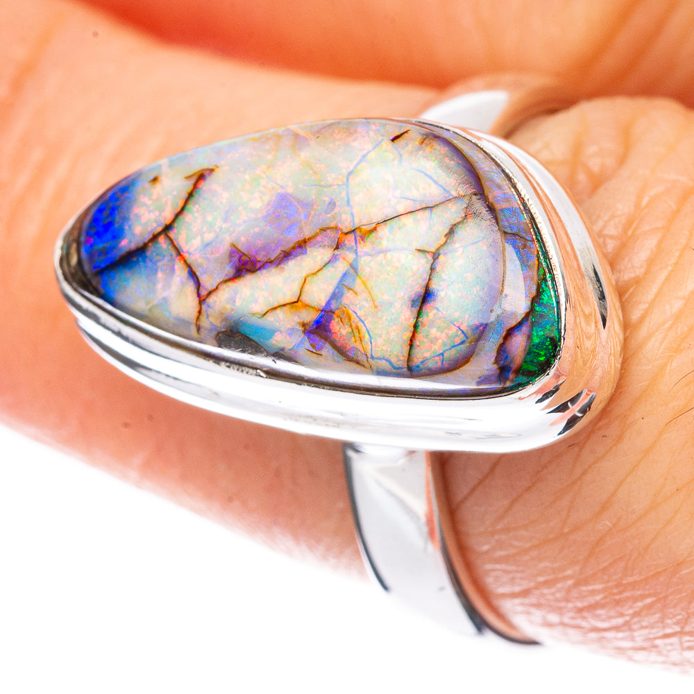 Sterling silver opal ring with oval blue-purple cabochon