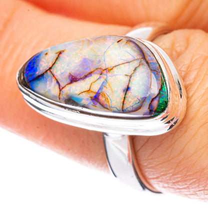 Sterling silver opal ring with oval blue-purple cabochon