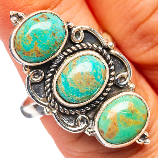 Sterling silver ring with three bezel-set round turquoise cabochons and ornate ropework