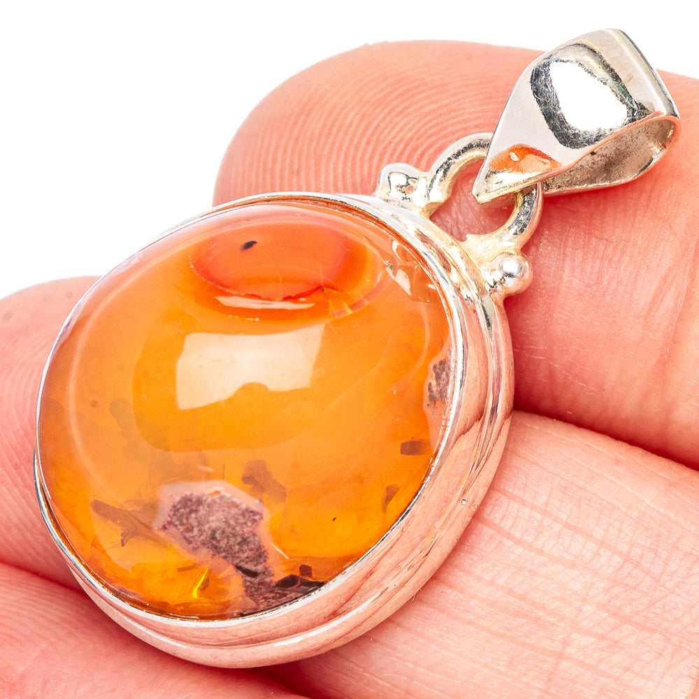 Sterling silver fire opal pendant with round orange cabochon and bail