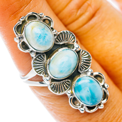 Sterling silver ring with three oval opal-blue stones in ornate settings