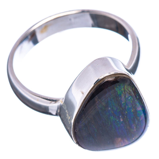 Silver ring with oval ammolite stone, blue-green iridescent face in bezel setting