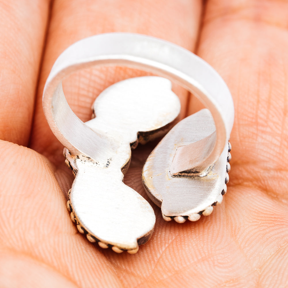Sterling silver adjustable ring band with cutout metal design