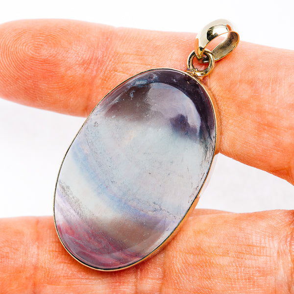 Oval fluorite cabochon pendant with german silver bezel and purple-blue stone