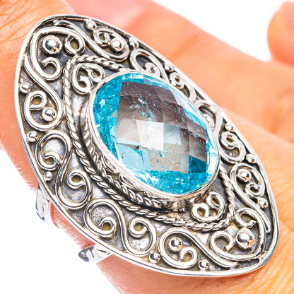 Sterling silver oval blue topaz ring with ornate filigree bezel