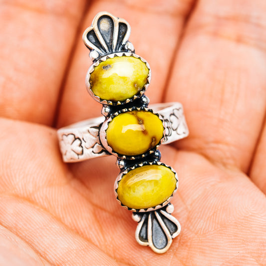 Silver ring with three yellow oval cabochon stones and floral side engraving