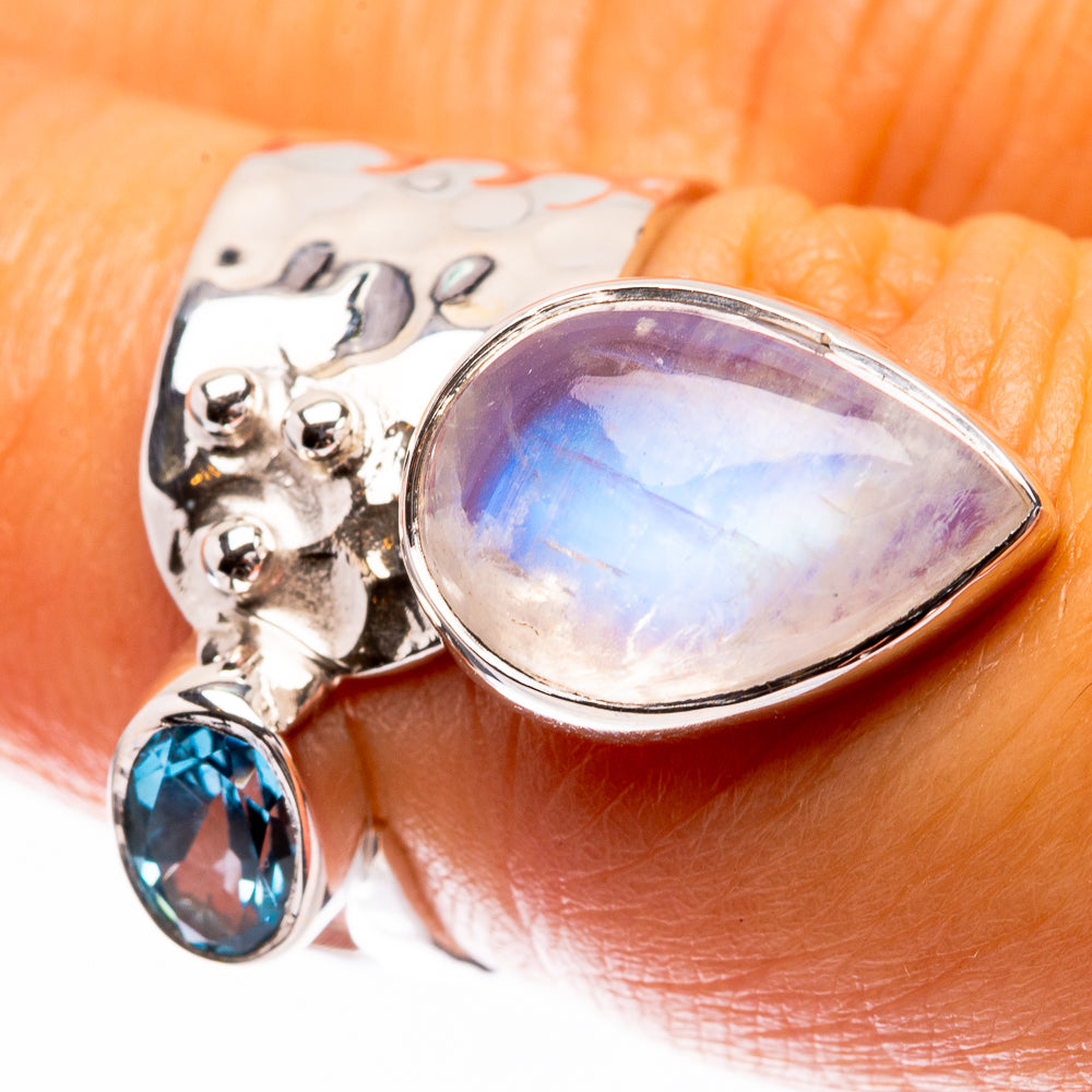 Sterling silver moonstone teardrop ring with blue gemstone and textured scalloped band