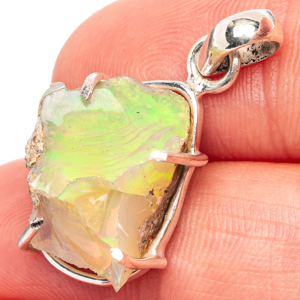 Raw Ethiopian opal pendant in .925 sterling silver setting, loop bail, multicolor green.