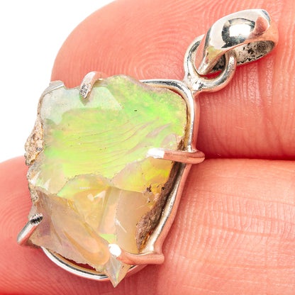 Raw Ethiopian opal pendant in .925 sterling silver setting, loop bail, multicolor green.