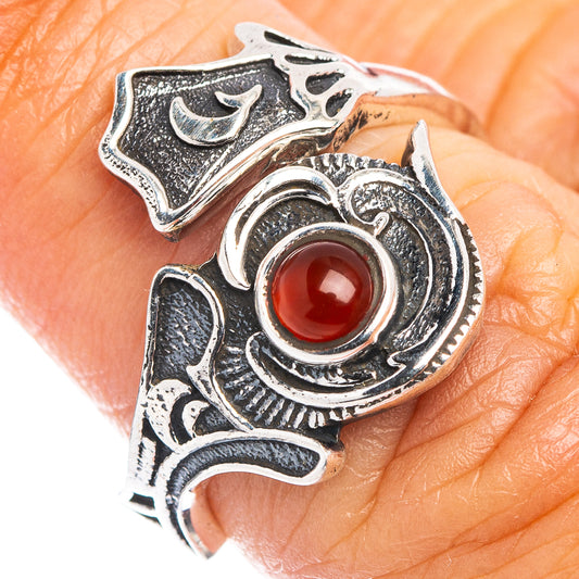Adjustable sterling silver ring with round red carnelian cabochon and ornate filigree