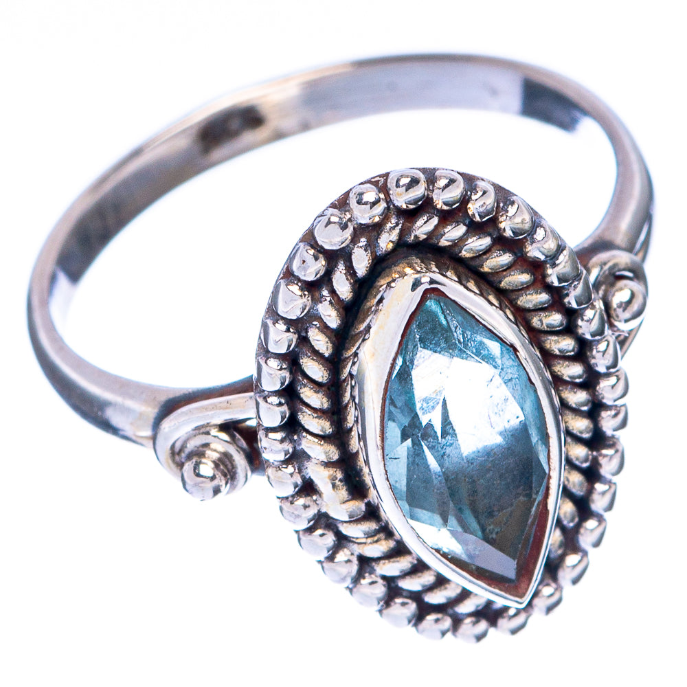Sterling silver oval blue topaz ring, side view of beaded prong setting