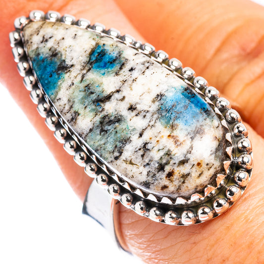 Adjustable sterling silver ring with oval white-and-blue stone bezel