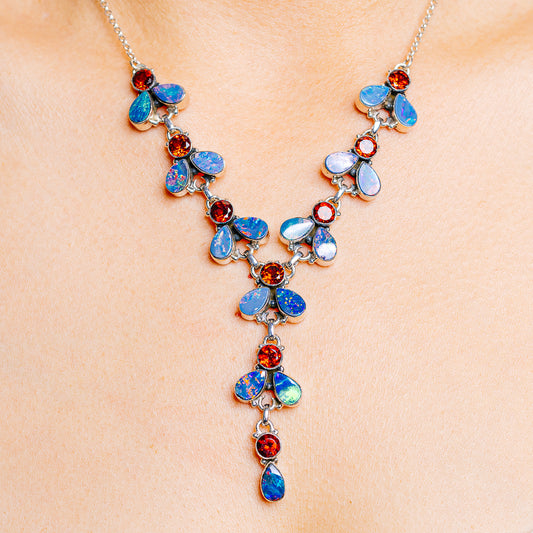 925 sterling silver necklace with blue opal flowers and red garnet-style gemstone accents