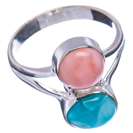 Sterling silver ring, angled view, with pink oval cabochon and blue-green oval stone