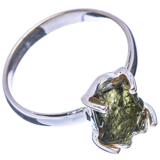 Sterling silver ring featuring irregular green moldavite stone on side prongs