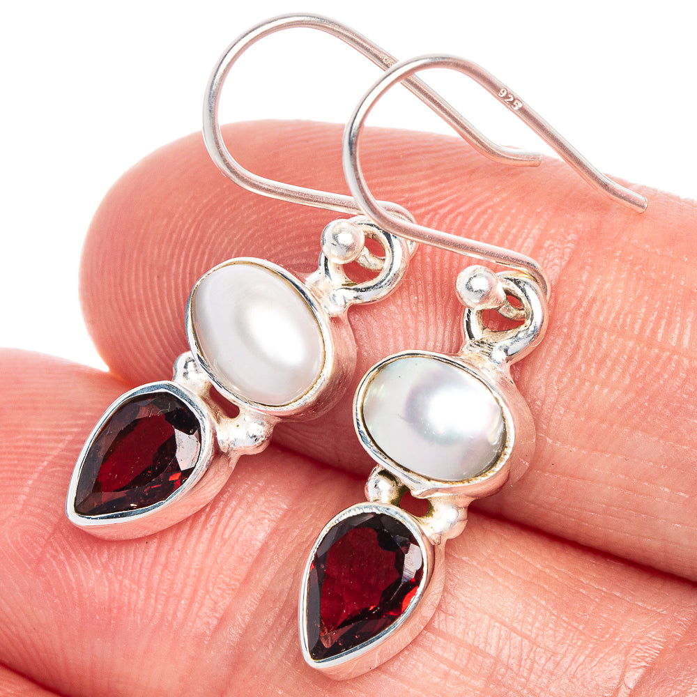 Sterling silver leverback earrings with white oval pearl and red garnet teardrops