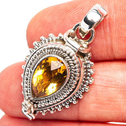 Sterling silver citrine poison pendant with yellow gemstone center and ornate beaded setting
