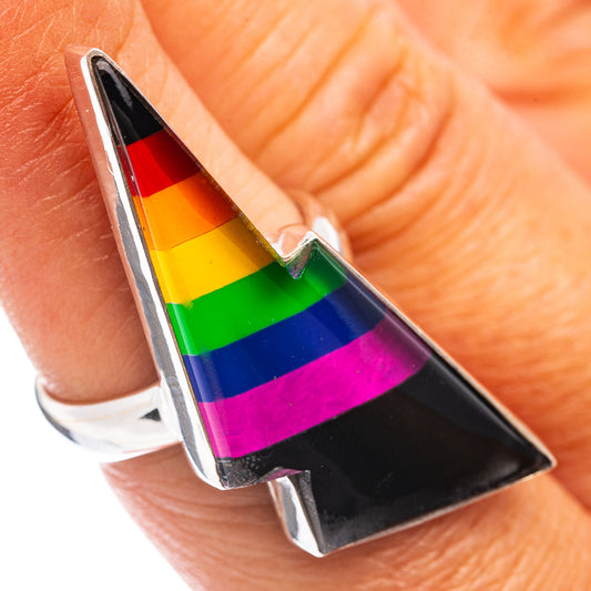 Sterling silver rainbow bolt ring with multicolor stripes on black enamel.