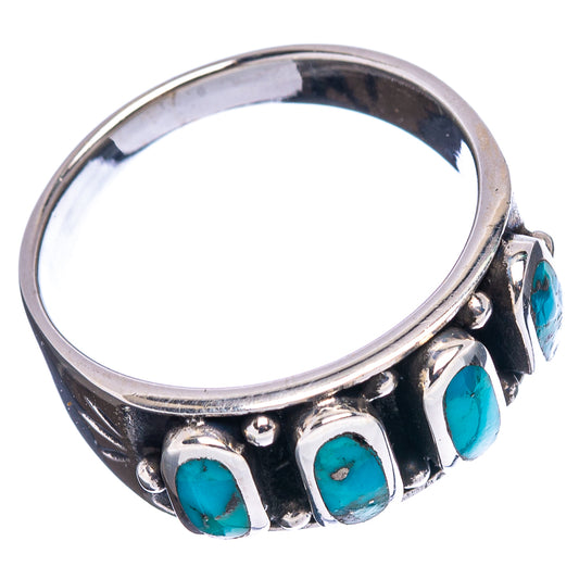 Sterling silver turquoise ring with four oval turquoise cabochon stones on a wide band