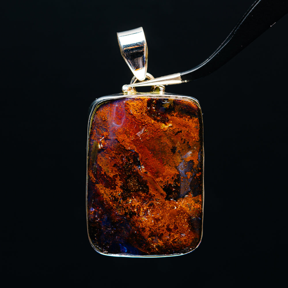 Sterling silver boulder opal pendant with rectangular amber-orange stone, textured bezel