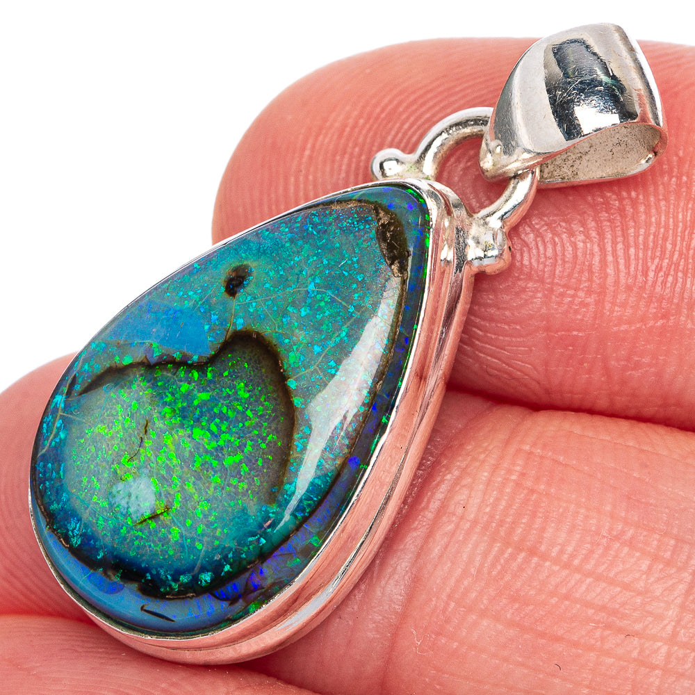 Sterling silver opal pendant with oval bezel and hinged bail, vivid blue-green stone