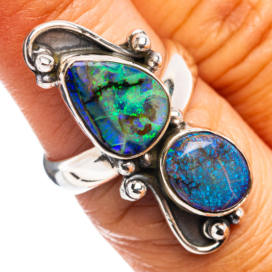 Sterling silver opal ring with pear-shaped green-blue stones, adjustable setting