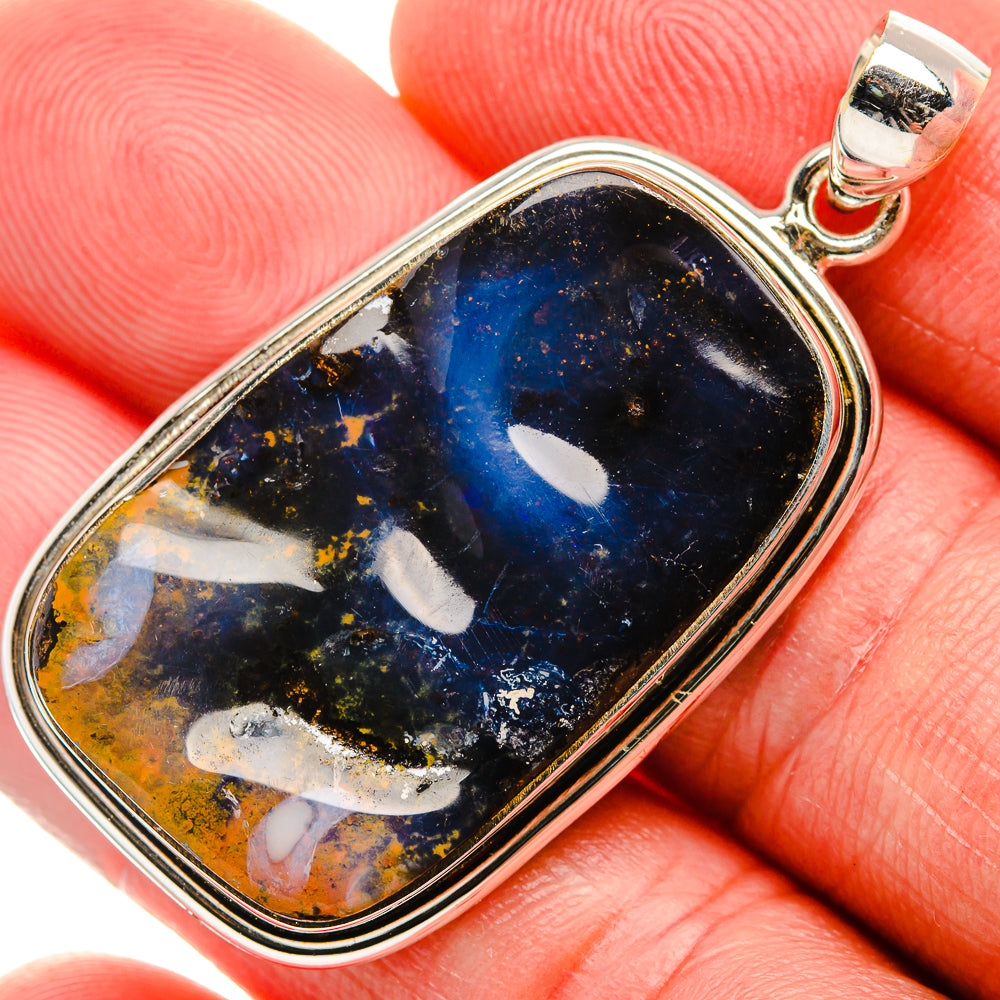 Sterling silver pendant with dark blue boulder opal cabochon, teardrop bezel and bail