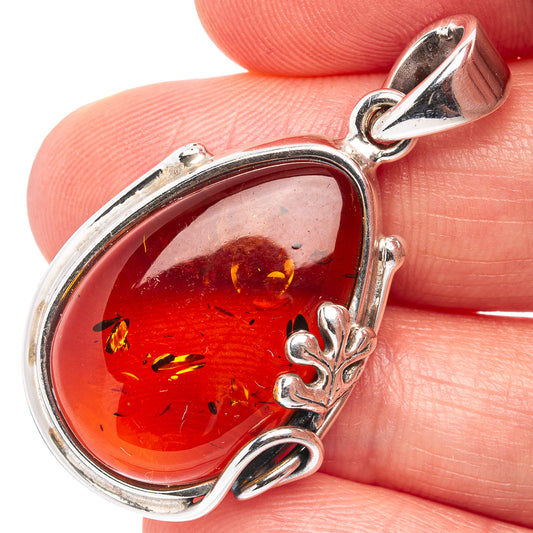 Sterling silver leaf-frame amber pendant with reddish teardrop and bail